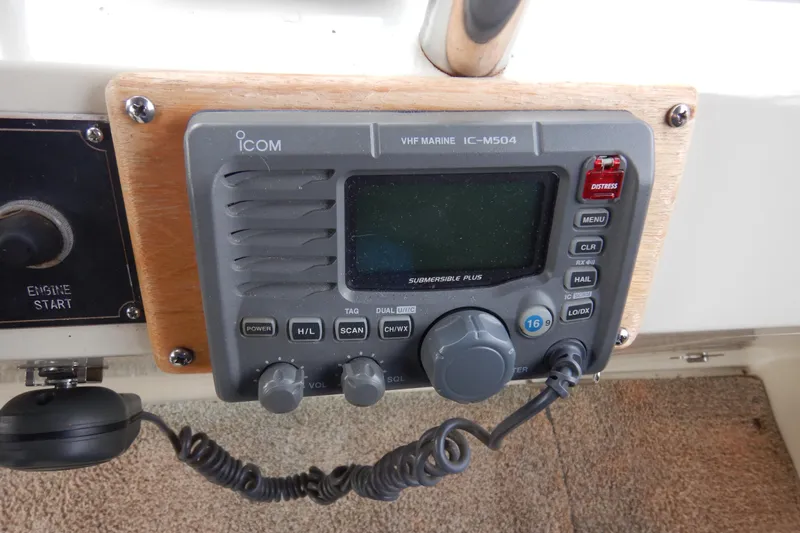 Slide: The Image of Interior view of 1988 Camargue 48 Cockpit Motor Yacht with rainy window and flags. - 62