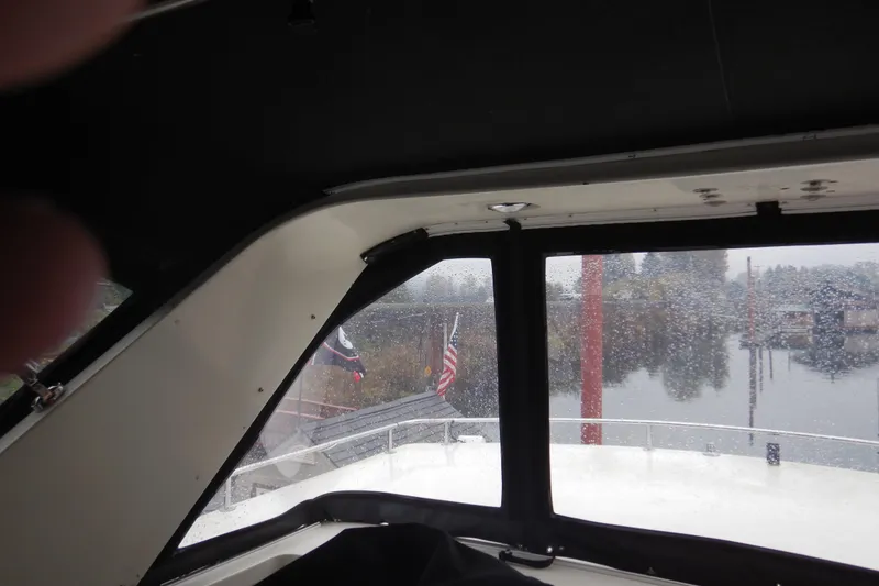 Slide: The Image of Interior of 1988 Camargue 48 Yacht with wooden stairs and seating area. - 64