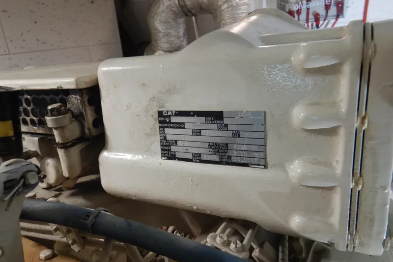 Slide: The Image of Engine room of 1988 Camargue 48 Cockpit Motor Yacht with visible components. - 71