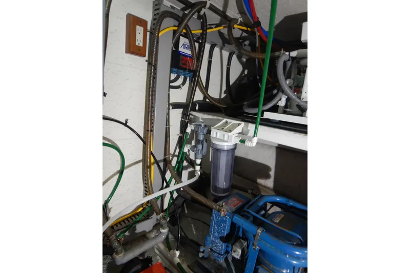 Slide: The Image of Interior of 1988 Camargue 48 Cockpit Motor Yacht with speakers and phone. - 77