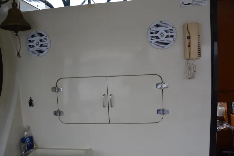 Slide: The Image of Control panel of 1988 Camargue 48 Cockpit Motor Yacht with labeled switches. - 80