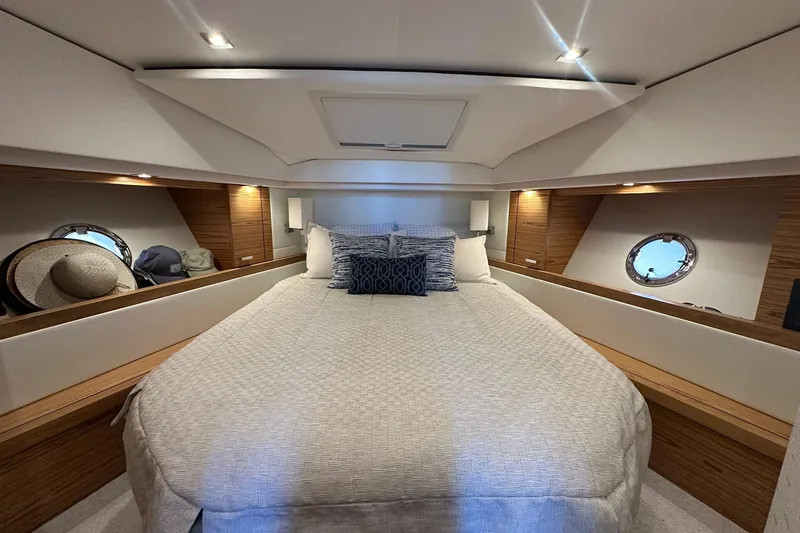 Slide: The Image of Luxurious 2023 Tiara Yachts C39 Coupe cabin with elegant bedding and stylish wood accents. - 12