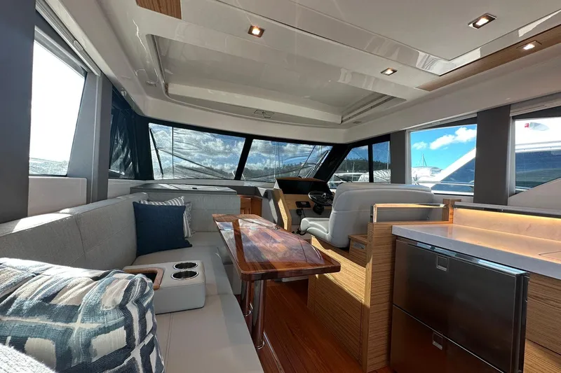 Slide: The Image of Luxurious interior of 2023 Tiara Yachts C39 Coupe with modern seating and elegant design. - 14