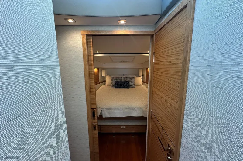 Slide: The Image of Luxurious bedroom interior of 2023 Tiara Yachts C39 Coupe, featuring elegant wood finishes. - 15