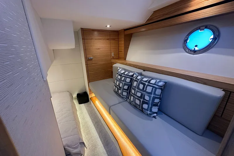 Slide: The Image of Luxurious interior of 2023 Tiara Yachts C39 Coupe with modern seating and porthole. - 17