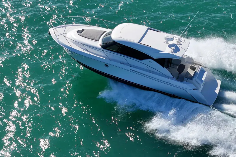 Slide: The Image of 2023 Tiara Yachts C39 Coupe cruising on vibrant turquoise waters. - 22