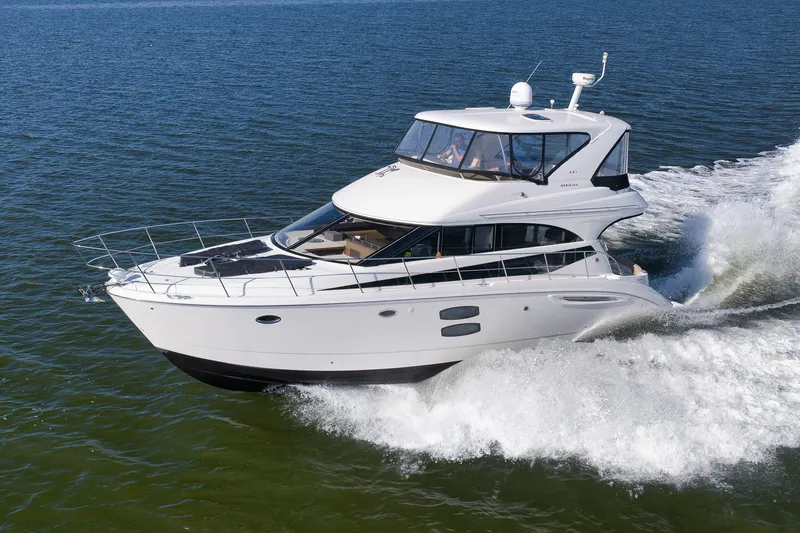 The Image of 2012 Meridian 441 Sedan yacht cruising on open water. - 1