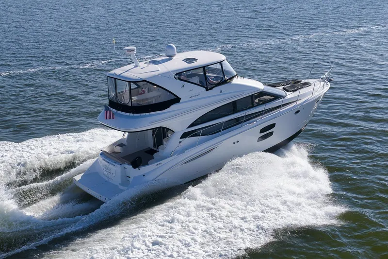 Slide: The Image of 2012 Meridian 441 Sedan yacht cruising on open water. - 18