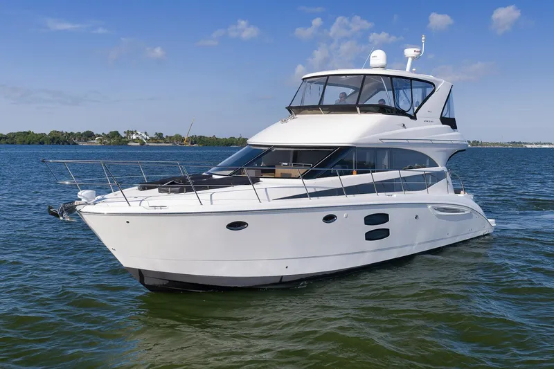 Slide: The Image of 2012 Meridian 441 Sedan yacht cruising on a sunny day. - 2