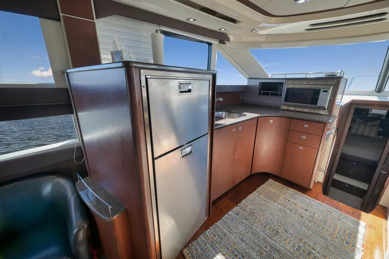 Slide: The Image of Luxurious 2012 Meridian 441 Sedan yacht interior with modern kitchen and ocean view. - 35