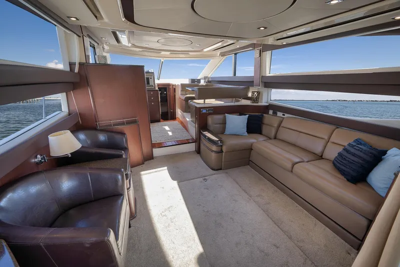Slide: The Image of Luxurious interior of 2012 Meridian 441 Sedan yacht with leather seating and panoramic windows. - 37