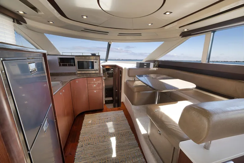 Slide: The Image of Luxurious interior of 2012 Meridian 441 Sedan yacht with modern kitchen and seating area. - 42