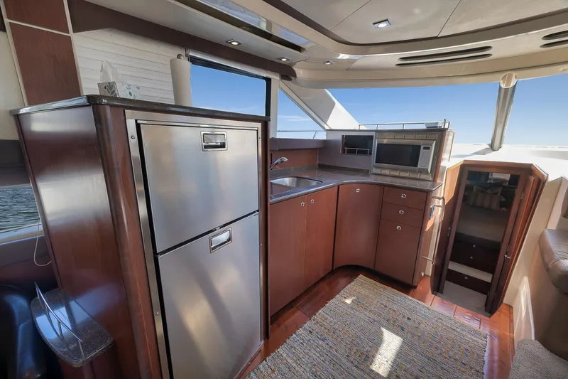 Slide: The Image of Interior of 2012 Meridian 441 Sedan yacht with modern kitchen and stainless steel appliances. - 44