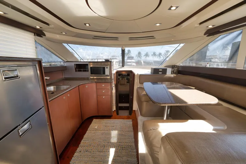 Slide: The Image of Luxurious interior of 2012 Meridian 441 Sedan yacht with modern kitchen and dining area. - 45