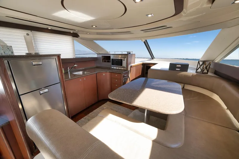 Slide: The Image of Luxurious interior of 2012 Meridian 441 Sedan yacht with modern kitchen and seating area. - 46