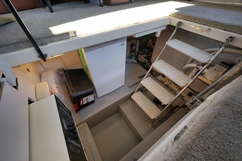 Slide: The Image of Engine room access of 2012 Meridian 441 Sedan with ladder and equipment. - 49