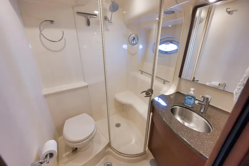 Slide: The Image of Luxurious bathroom in 2012 Meridian 441 Sedan yacht with shower, toilet, and sink. - 50