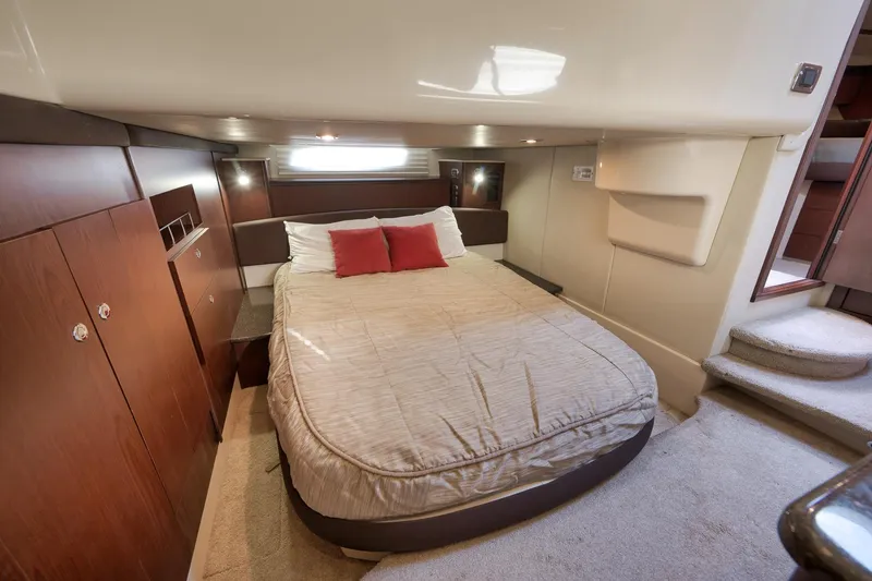 Slide: The Image of Luxurious bedroom interior of 2012 Meridian 441 Sedan yacht with cozy bed and wooden accents. - 54