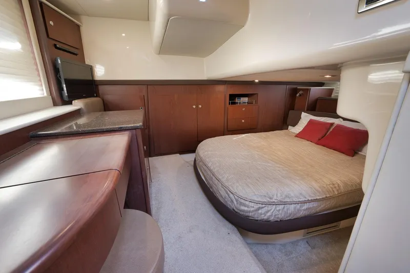 Slide: The Image of Luxurious cabin interior of 2012 Meridian 441 Sedan yacht with cozy bed and wood finishes. - 56