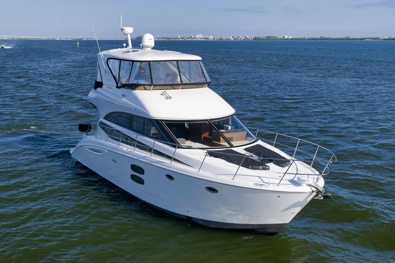 Slide: The Image of 2012 Meridian 441 Sedan yacht cruising on open water. - 6