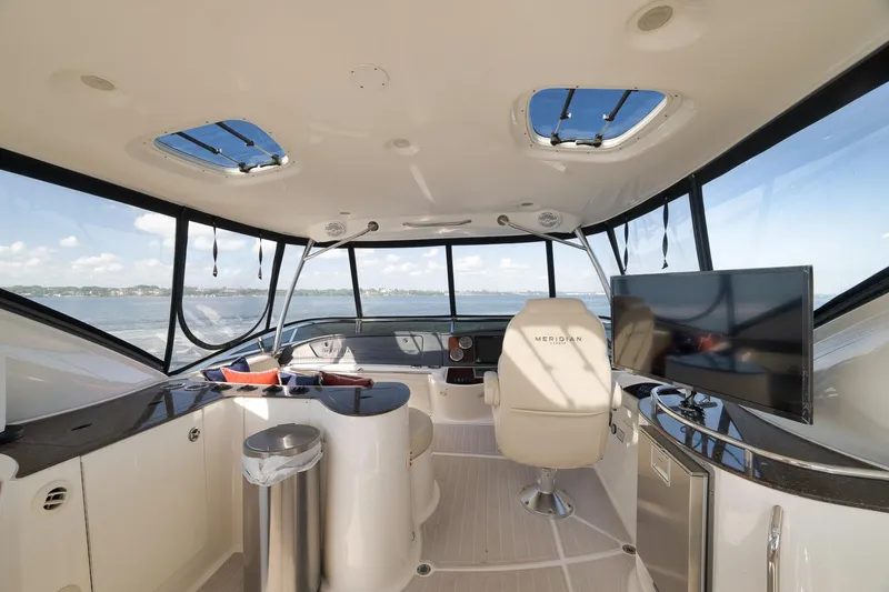 Slide: The Image of Luxurious interior of 2012 Meridian 441 Sedan yacht with panoramic windows and modern amenities. - 61