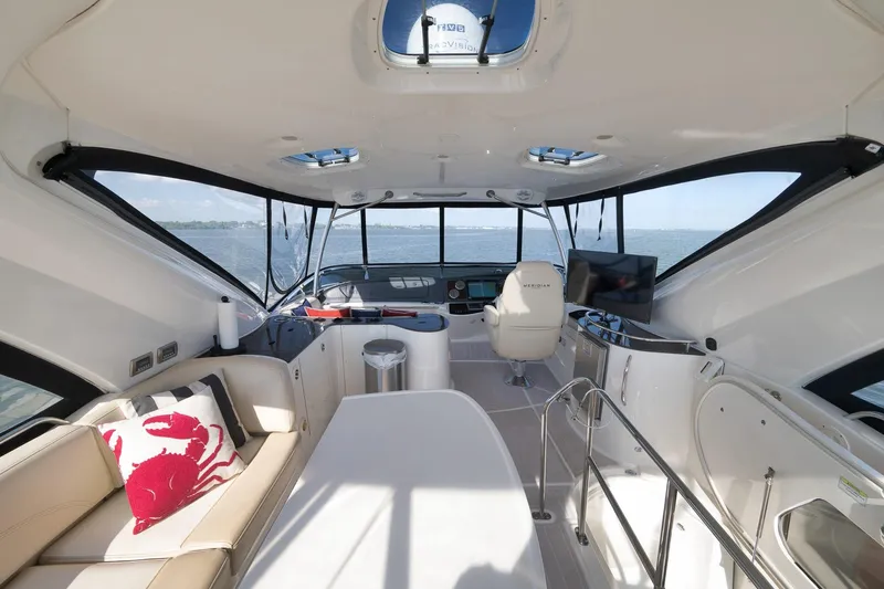 Slide: The Image of Interior of 2012 Meridian 441 Sedan yacht with modern seating and ocean view. - 65