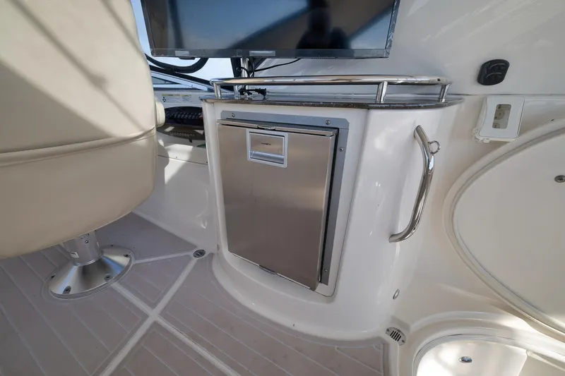 Slide: The Image of Interior of 2012 Meridian 441 Sedan yacht with seating and stainless steel cabinet. - 66