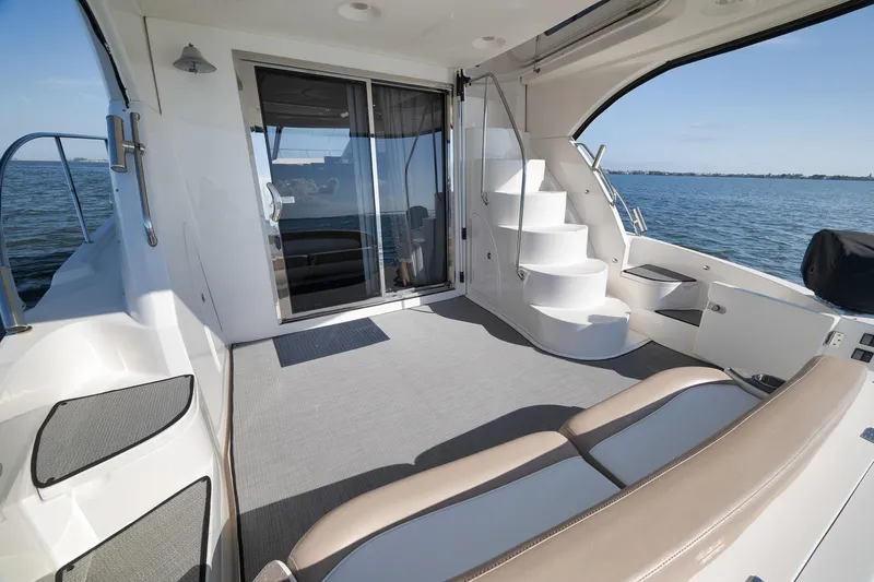 Slide: The Image of Luxurious 2012 Meridian 441 Sedan yacht interior with elegant seating and ocean view. - 68