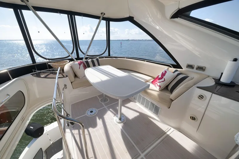 Slide: The Image of Luxurious 2012 Meridian 441 Sedan yacht interior with ocean view and elegant seating area. - 70