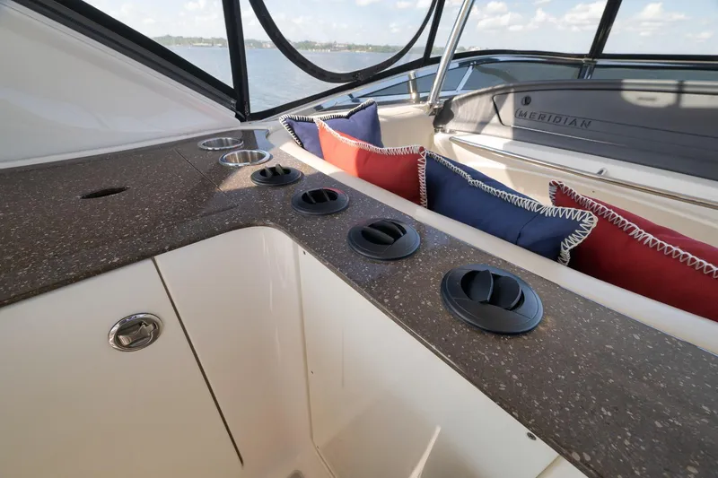 Slide: The Image of Interior of 2012 Meridian 441 Sedan yacht with cushions and cup holders. - 73