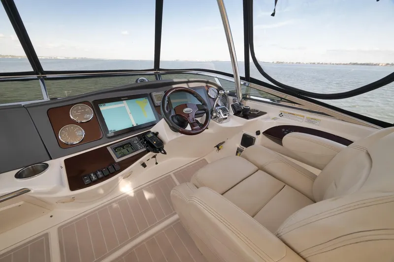 Slide: The Image of Luxurious 2012 Meridian 441 Sedan yacht cockpit with leather seating and advanced navigation system. - 74