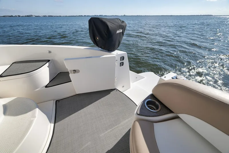 Slide: The Image of 2012 Meridian 441 Sedan yacht deck with seating, overlooking calm ocean waters. - 80