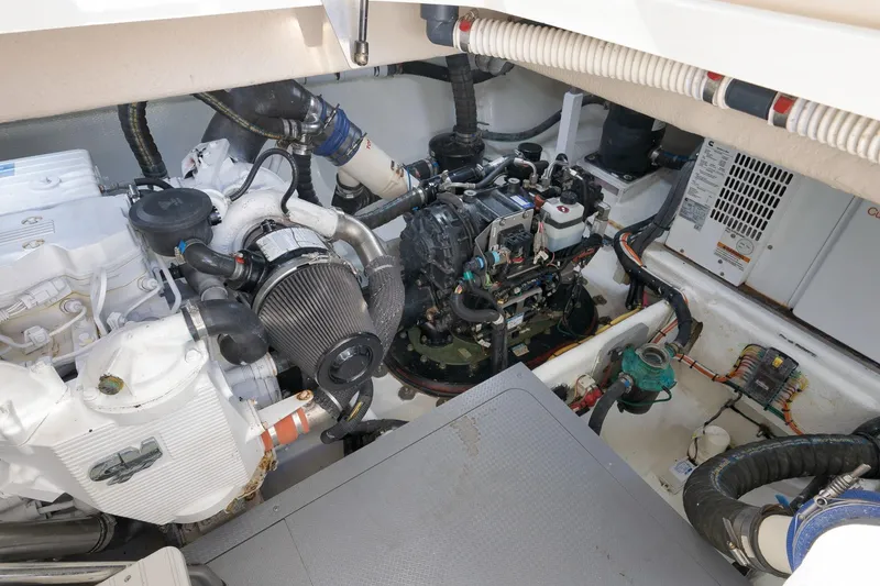 Slide: The Image of Engine room of a 2012 Meridian 441 Sedan yacht, showcasing mechanical components. - 83