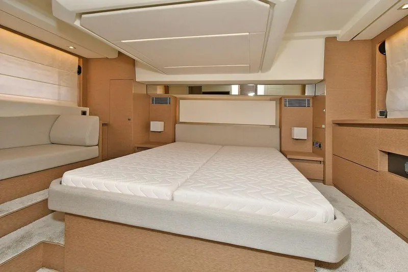 Slide: The Image of Luxurious interior of 2019 Prestige 460 yacht featuring a spacious bedroom. - 17