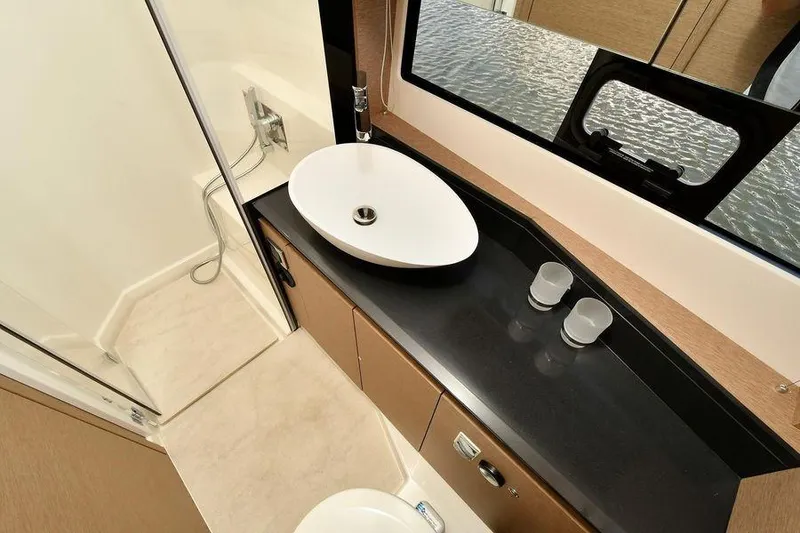 Slide: The Image of Luxurious bathroom interior of 2019 Prestige 460 yacht with modern sink and shower. - 21