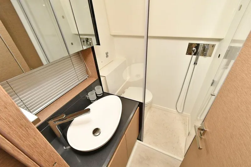 Slide: The Image of Modern bathroom in 2019 Prestige 460 yacht with sleek sink and shower. - 23
