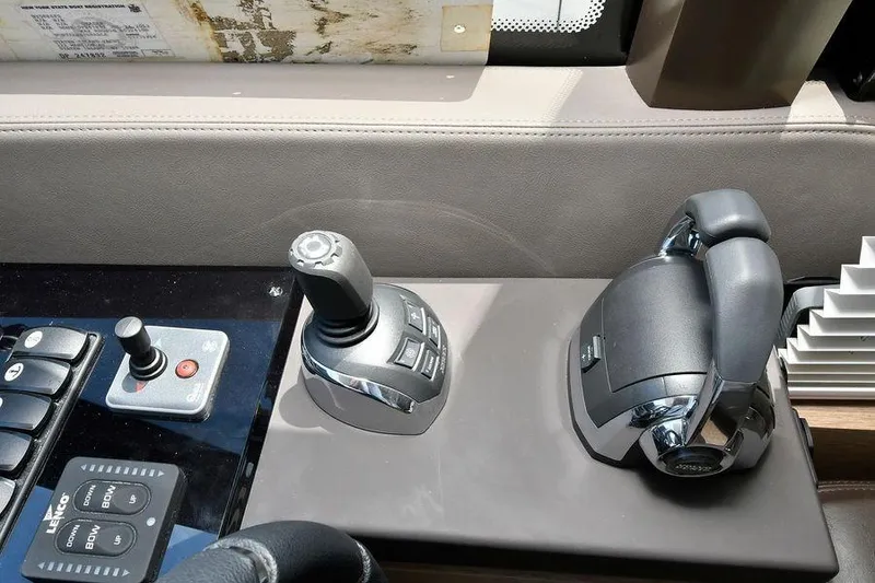 Slide: The Image of Control panel of a 2019 Prestige 460 yacht with joystick and throttle. - 27