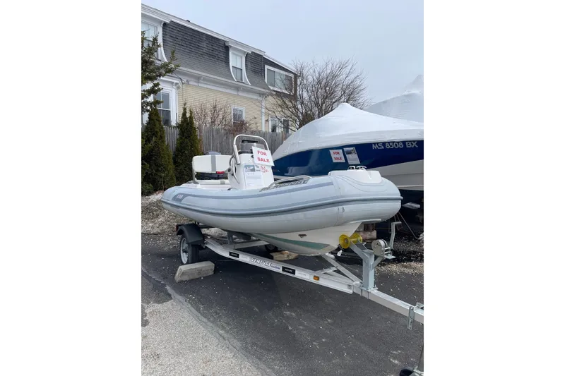 The Image of 2022 AB Inflatables Oceanus 12 VST boat on trailer, for sale sign visible. - 0