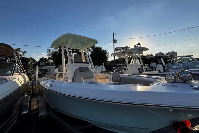 Slide: The Image of 2021 Key West 239 FS boat in a marina at sunset, showcasing sleek design. - 7