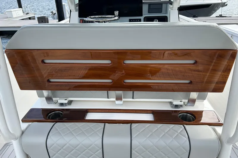 Slide: The Image of 2023 Pursuit S 288 Sport boat interior with wood accents and cup holders. - 25