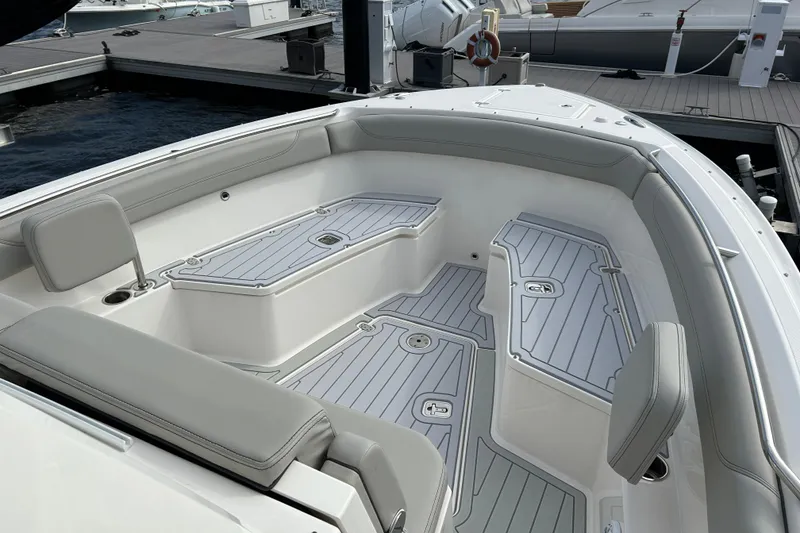 Slide: The Image of 2023 Pursuit S 288 Sport boat interior with sleek seating and storage compartments. - 40