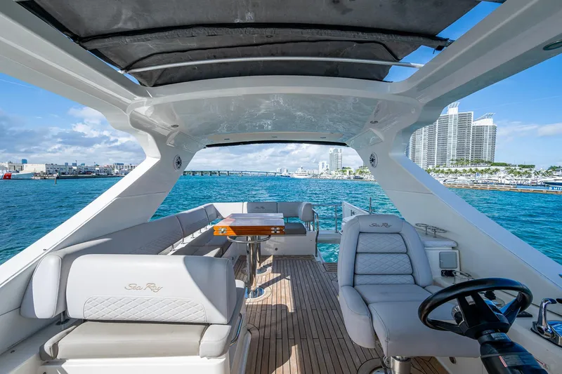 Slide: The Image of Luxurious 2018 Sea Ray L550 Fly yacht interior with ocean view and modern seating. - 12