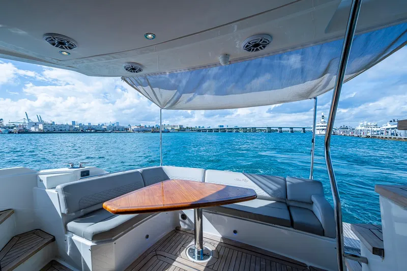 Slide: The Image of Luxurious 2018 Sea Ray L550 Fly yacht with elegant seating and ocean view. - 14