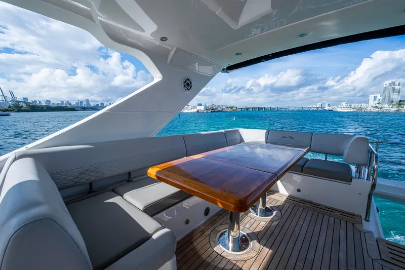 Slide: The Image of Luxurious 2018 Sea Ray L550 Fly yacht with elegant seating and ocean view. - 15