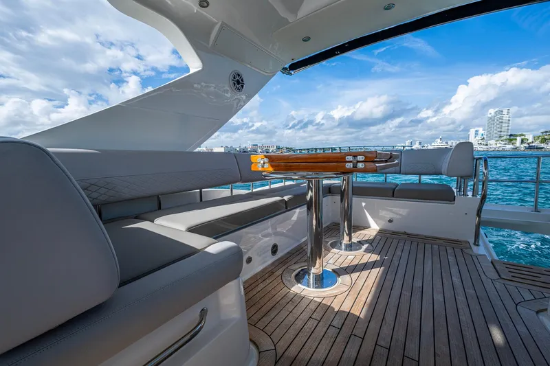 Slide: The Image of Luxurious 2018 Sea Ray L550 Fly yacht deck with elegant seating and ocean view. - 16