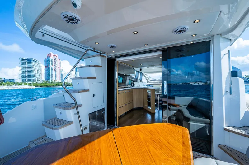 Slide: The Image of Luxurious 2018 Sea Ray L550 Fly yacht interior with ocean view and modern amenities. - 19