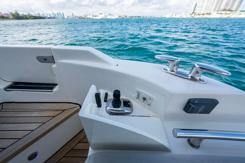 Slide: The Image of 2018 Sea Ray L550 Fly yacht deck with ocean view and control panel. - 20