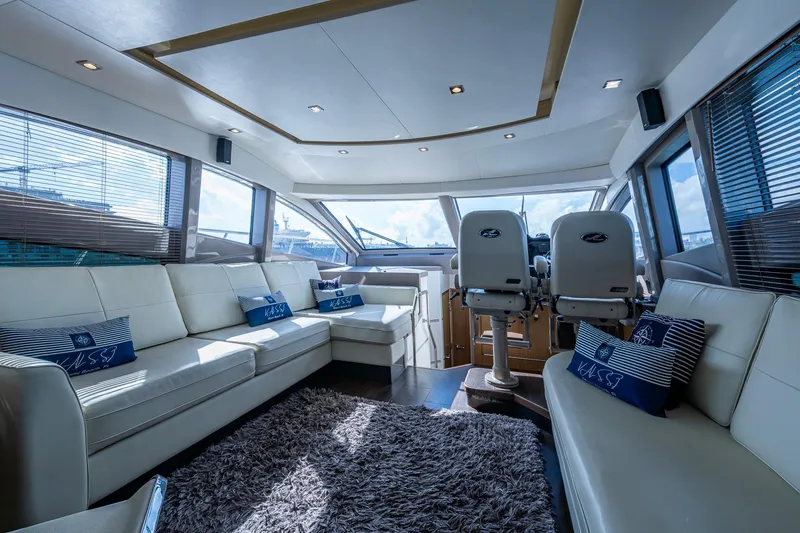 Slide: The Image of Luxurious interior of 2018 Sea Ray L550 Fly yacht with plush seating and modern design. - 31