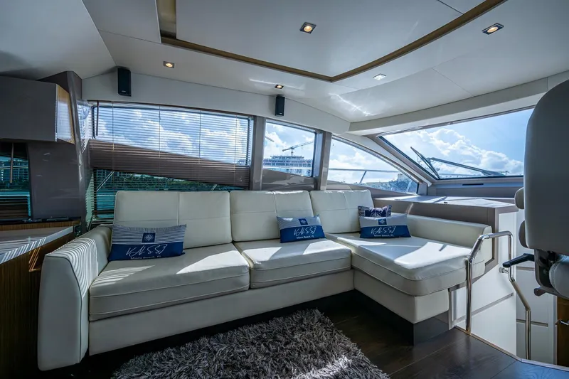 Slide: The Image of Luxurious interior of 2018 Sea Ray L550 Fly yacht with plush white seating. - 33