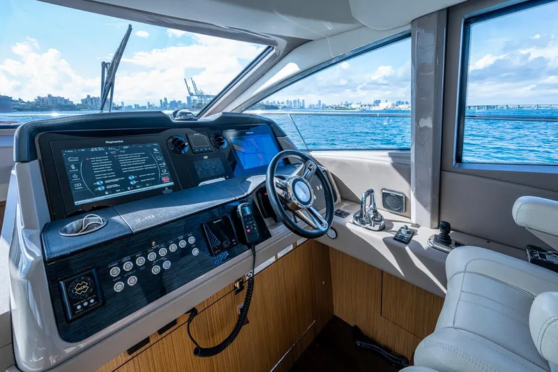 Slide: The Image of 2018 Sea Ray L550 Fly yacht helm with advanced navigation system and ocean view. - 37